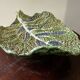 Vintage ceramic leaf-shaped vide poche, signed.