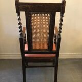 Carved wooden armchair and cannage