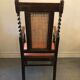Fauteuil en bois sculpté et cannage