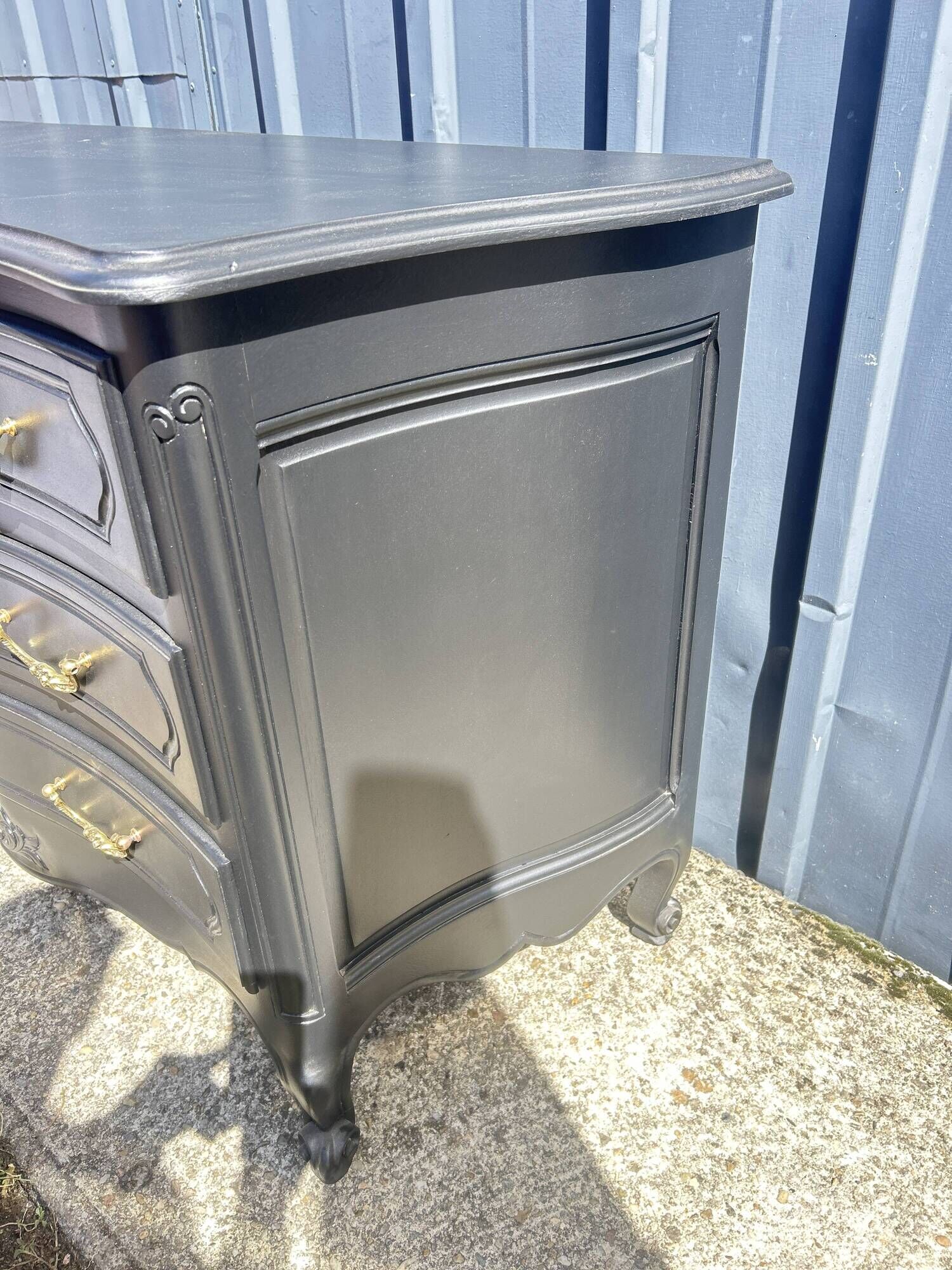 Louis XV style black lacquered chest of drawers with four drawers.