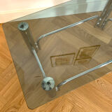 Coffee table in chrome-plated metal and smoked glass