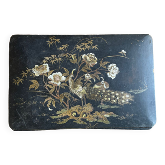Black flowery box made of boiled and lacquered cardboard