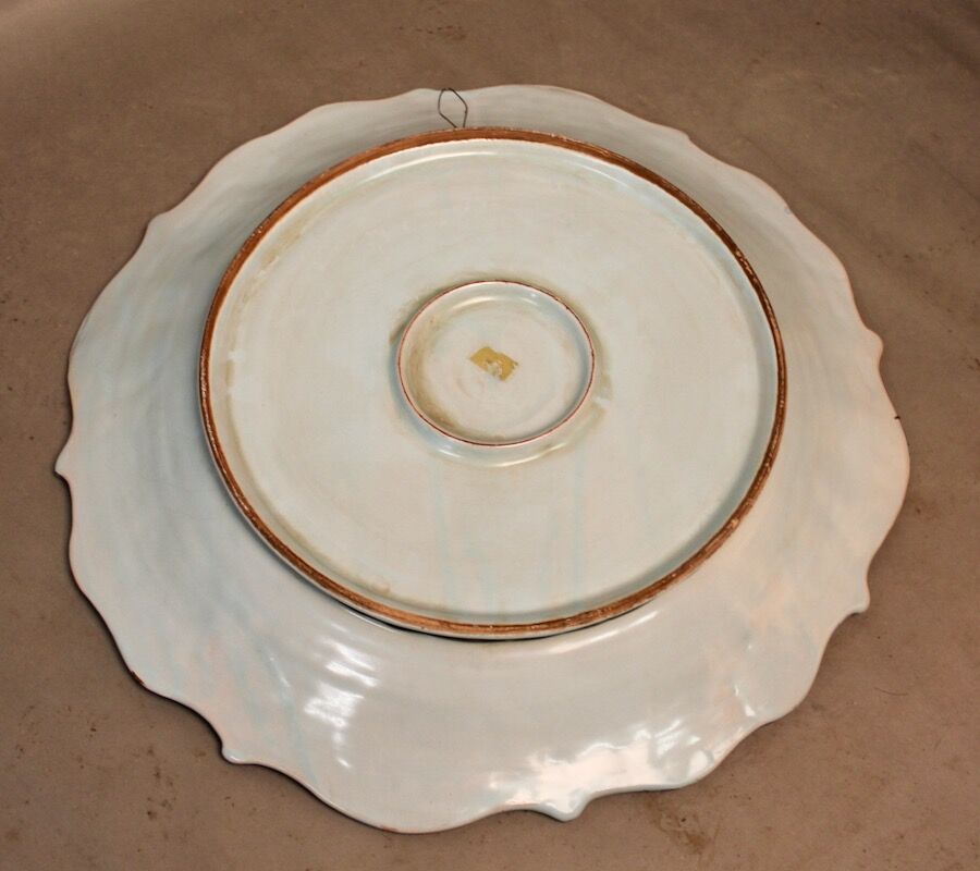 Round hollow dish in blue earthenware diameter 48 cm signed
