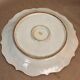 Plat creux rond en faïence bleue diamètre 48 cm signé