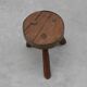 Brutalist French solid oak tripod stool with metal rim, 1850s