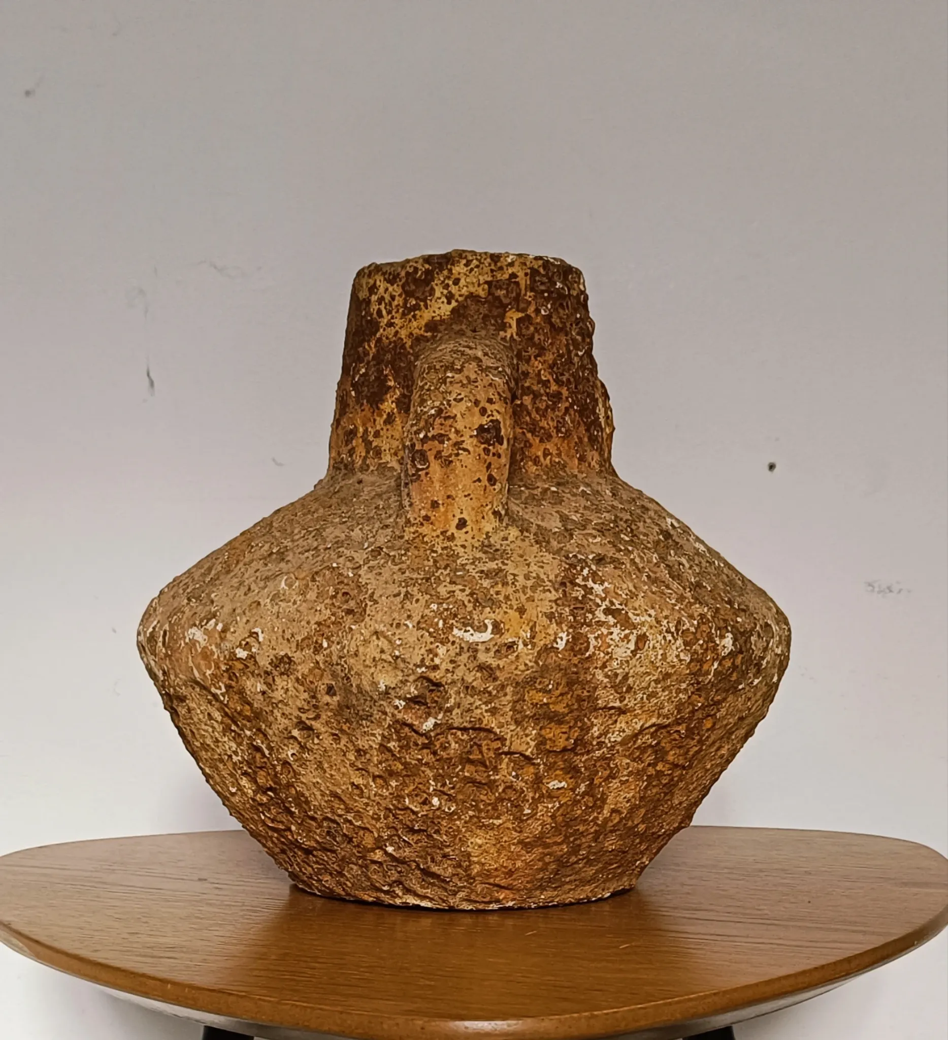 Textured terracotta vase in wabi-sabi style