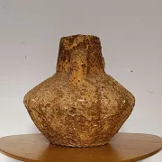 Textured terracotta vase in wabi-sabi style