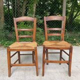 2 solid oak and straw wood chairs