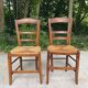 2 solid oak and straw wood chairs