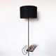 Black metal magazine rack floor lamp with ceramic shelf