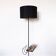 Black metal magazine rack floor lamp with ceramic shelf