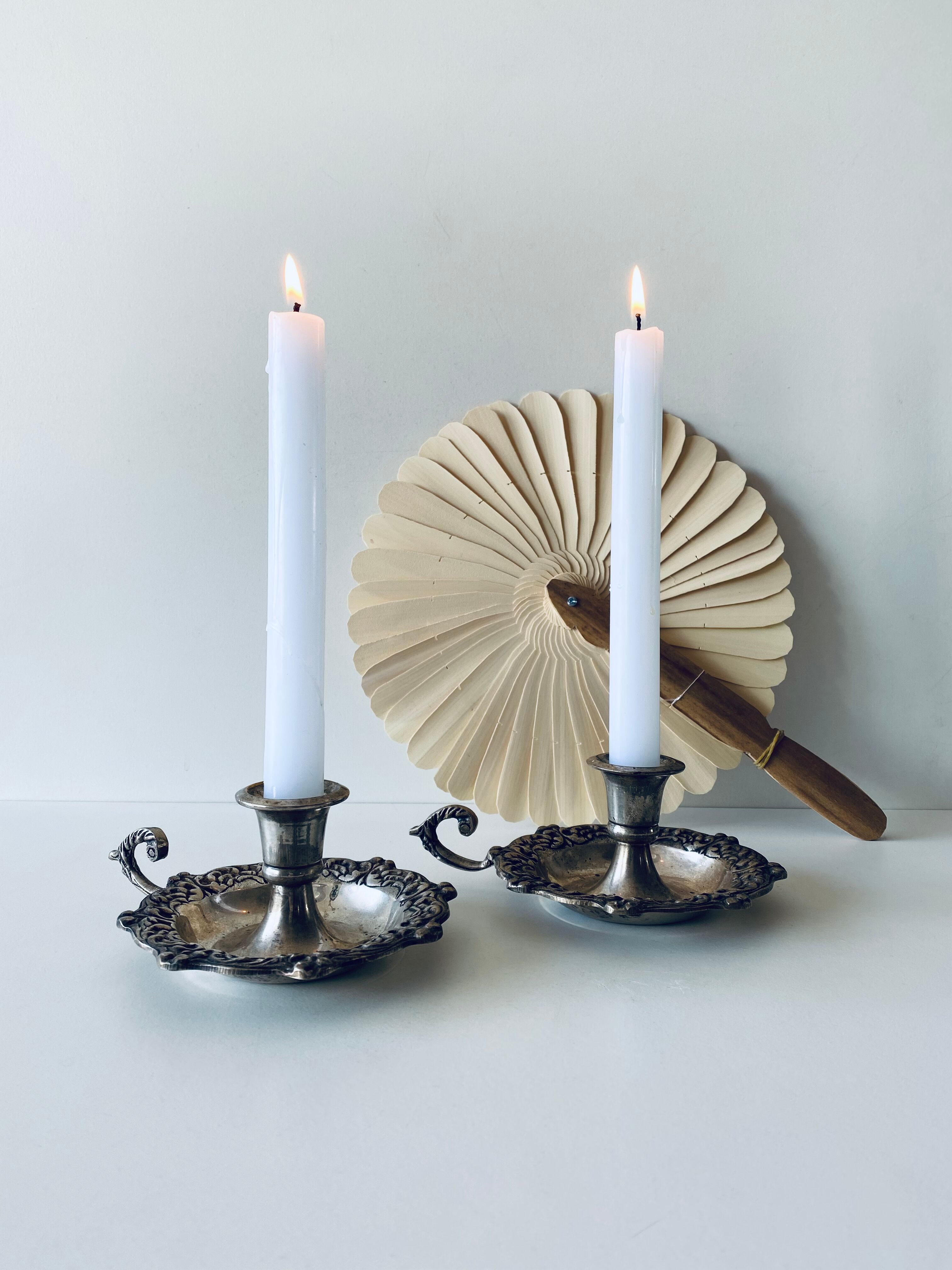 Pair of silver metal candlesticks