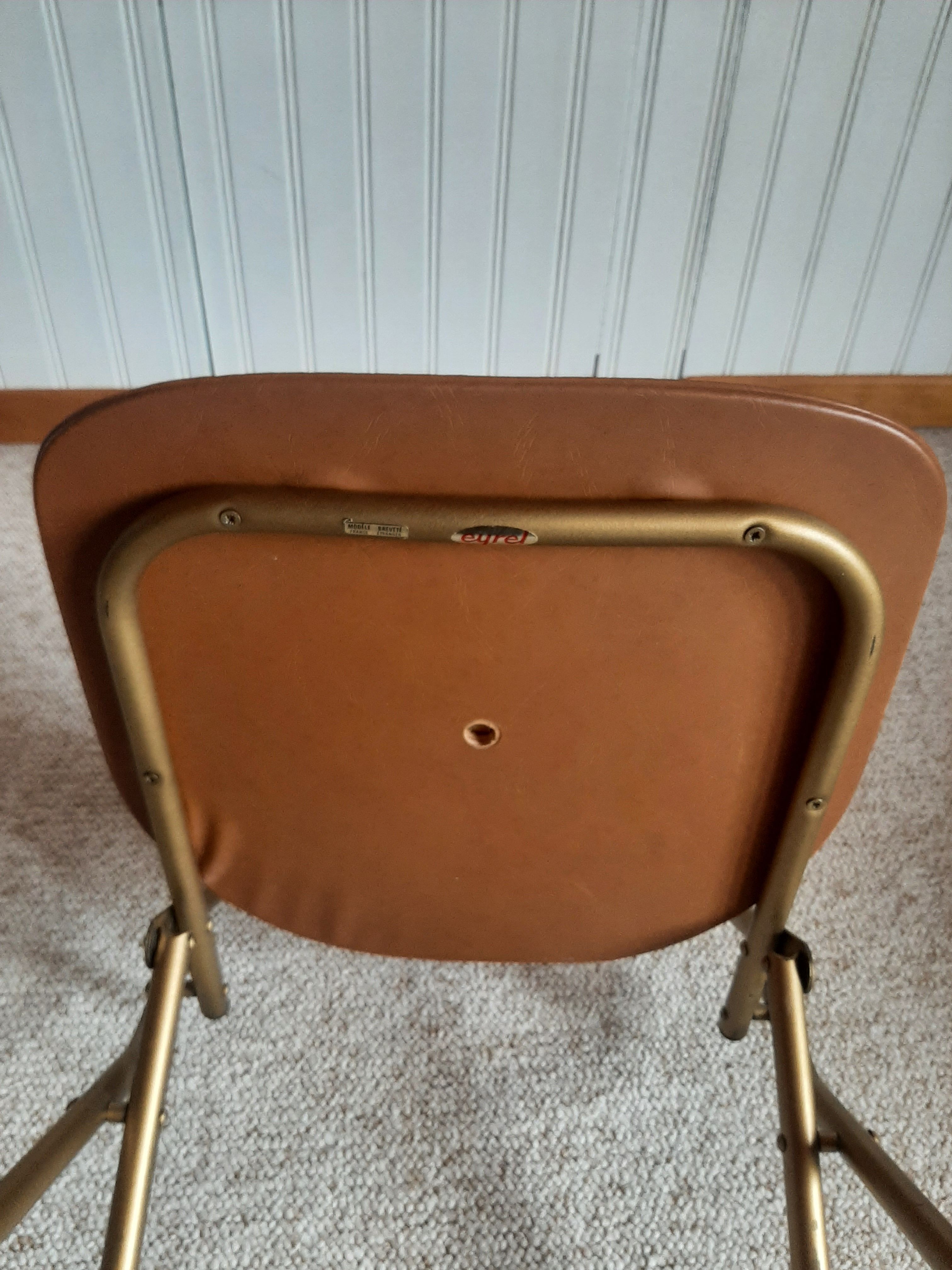 Chaise pliante structure tube et simili cuir