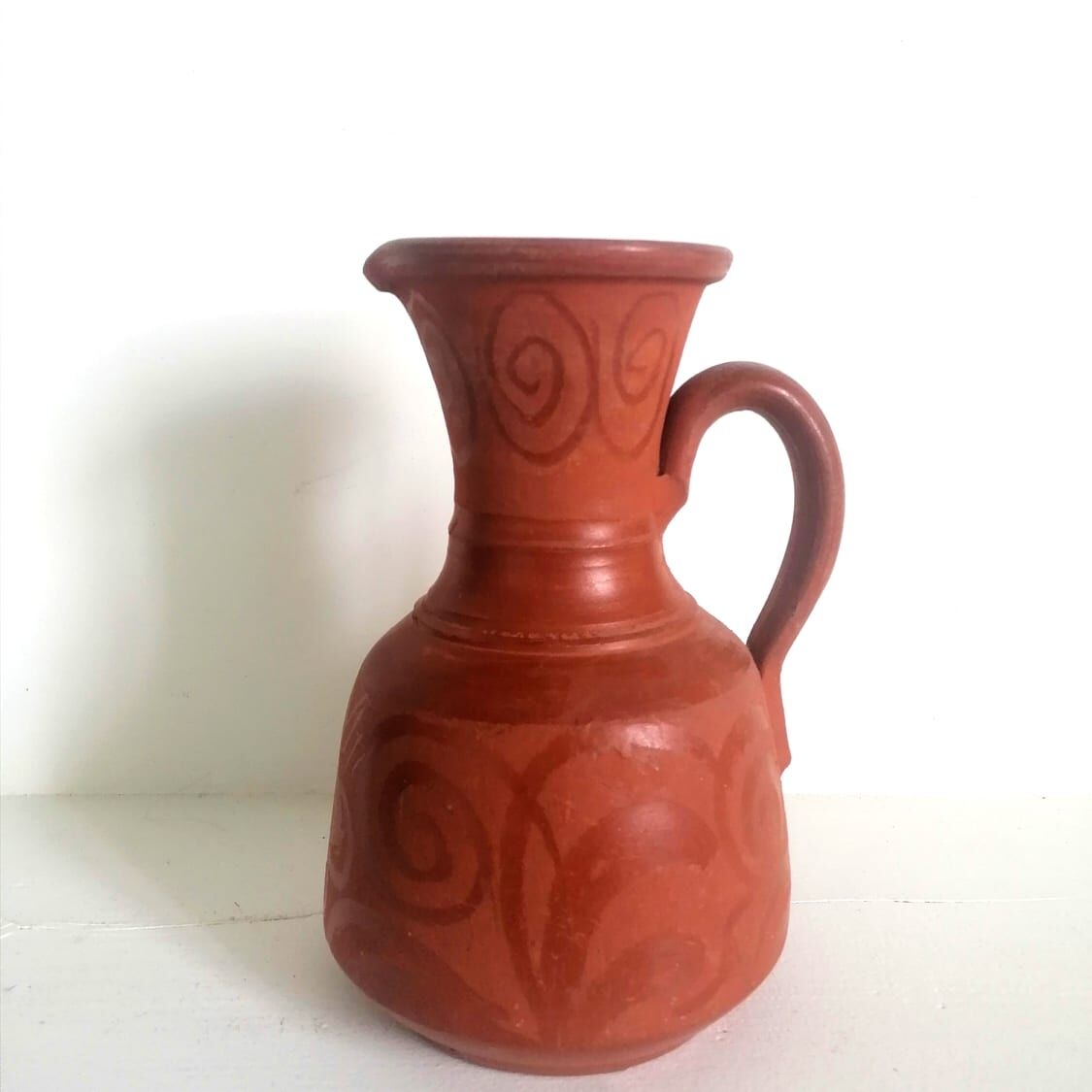Pitcher in oriental terracotta