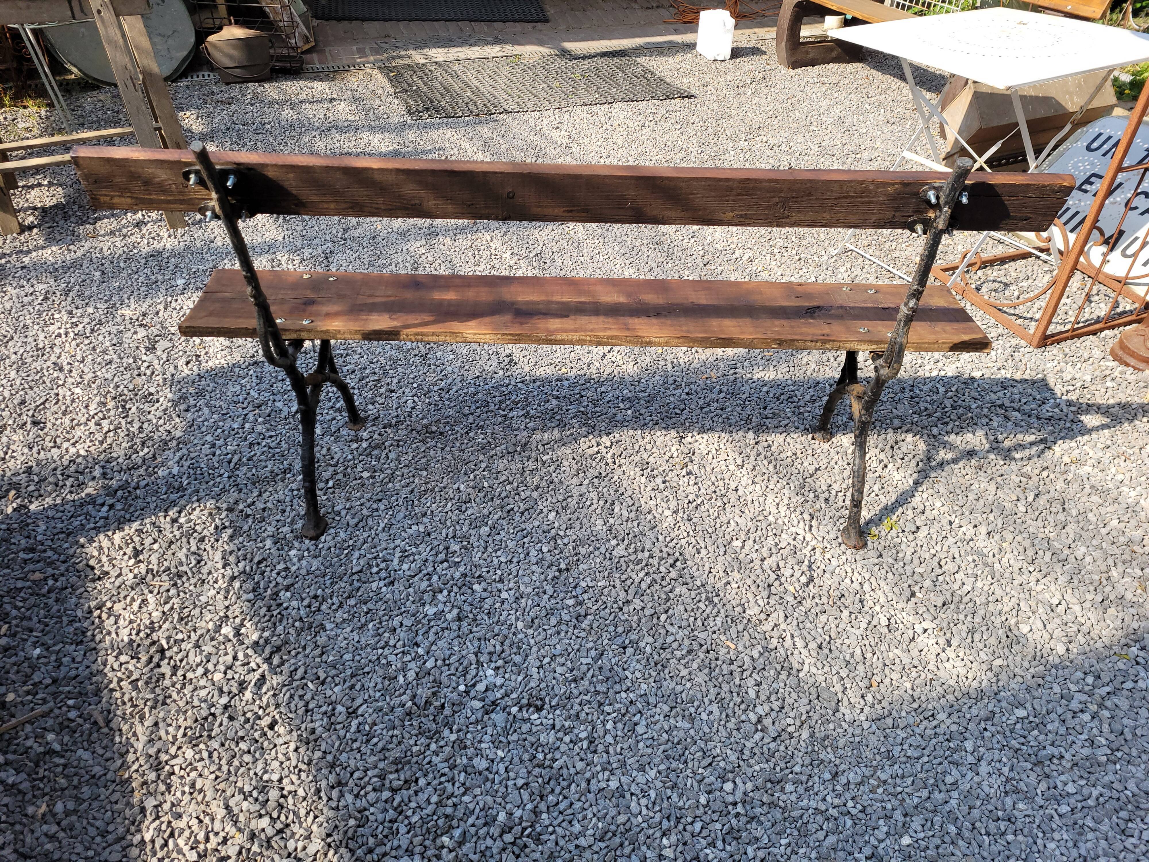 Garden bench cast iron bases and wooden seat