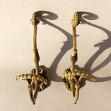 Pair of gilded bronze hooks Louis XVI style, nineteenth century.