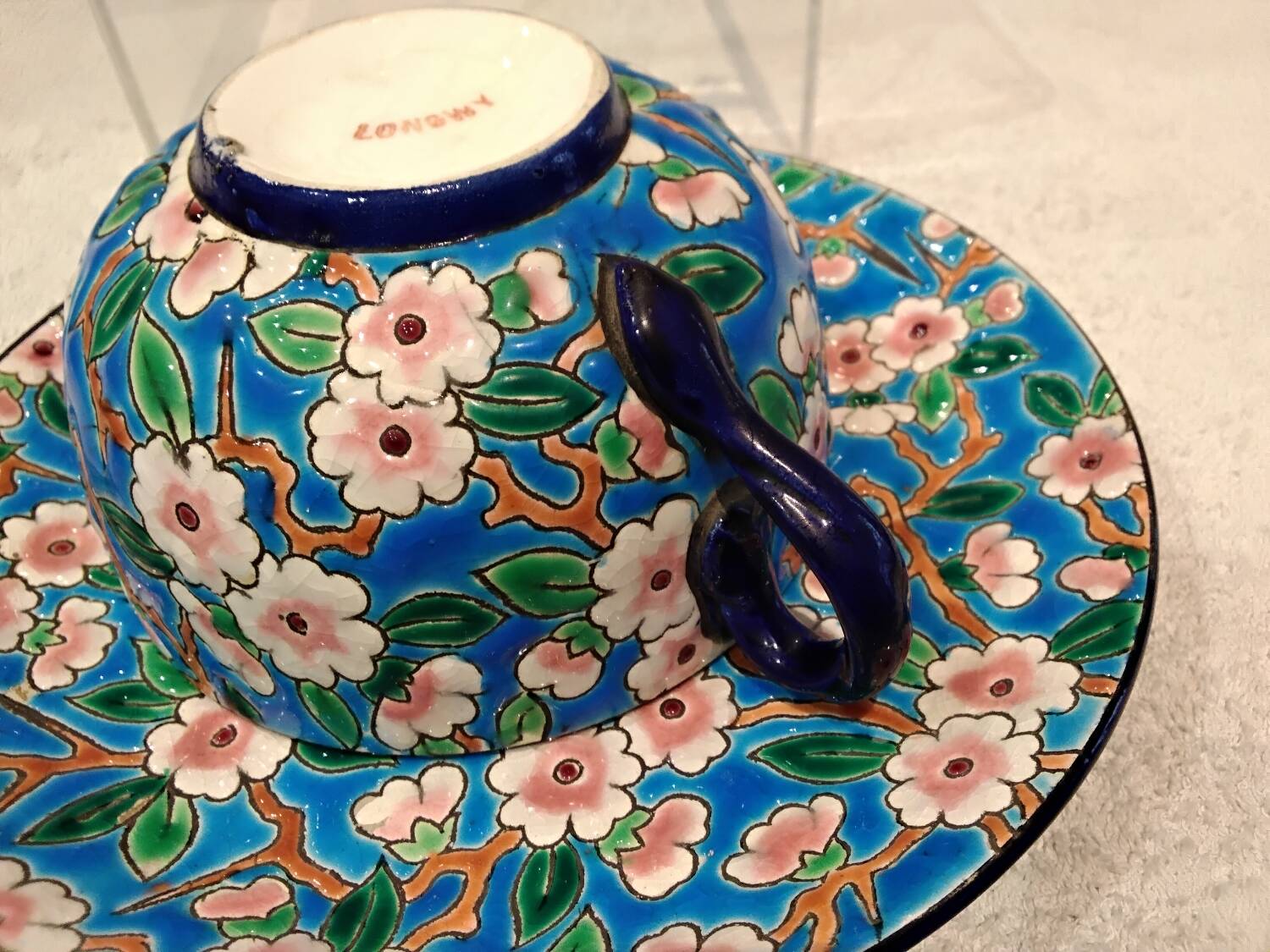 32cl teacup and saucer, Longwy enamel, apple blossom design, 188