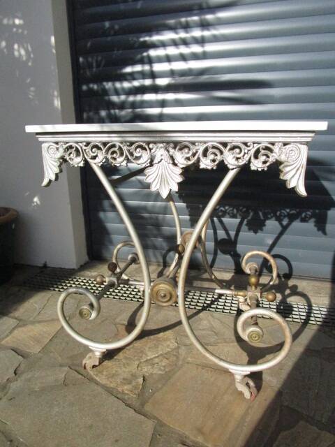 Butcher's table from the late 19th century, wrought iron, brass, and marble.