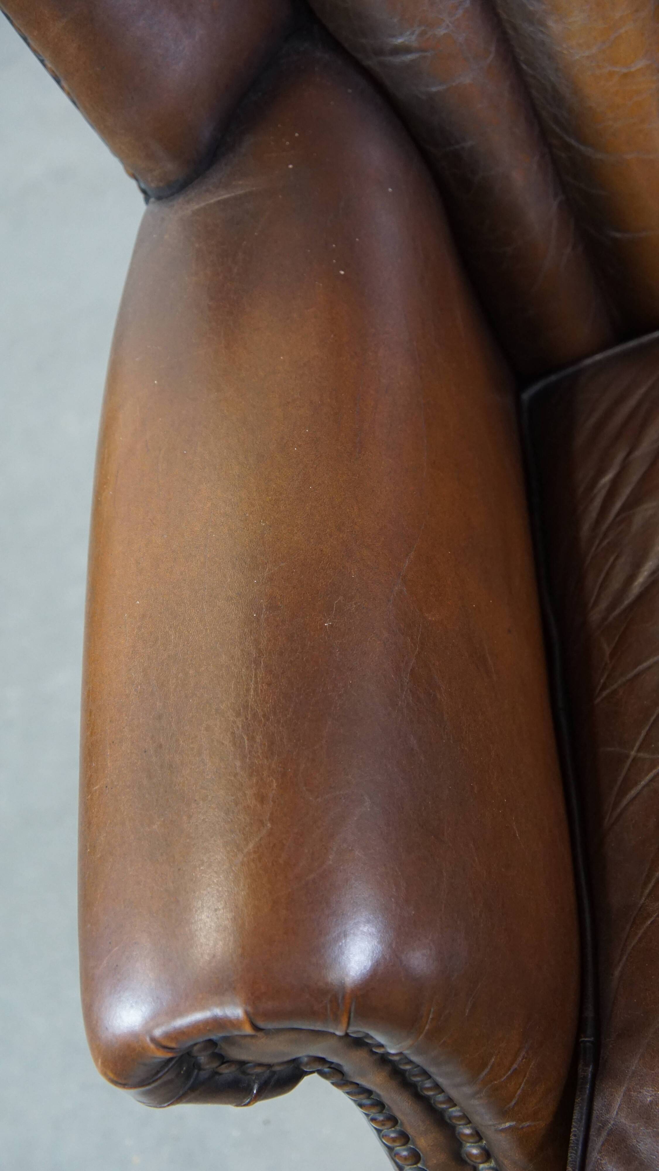 Sheep leather armchair finished with decorative nails