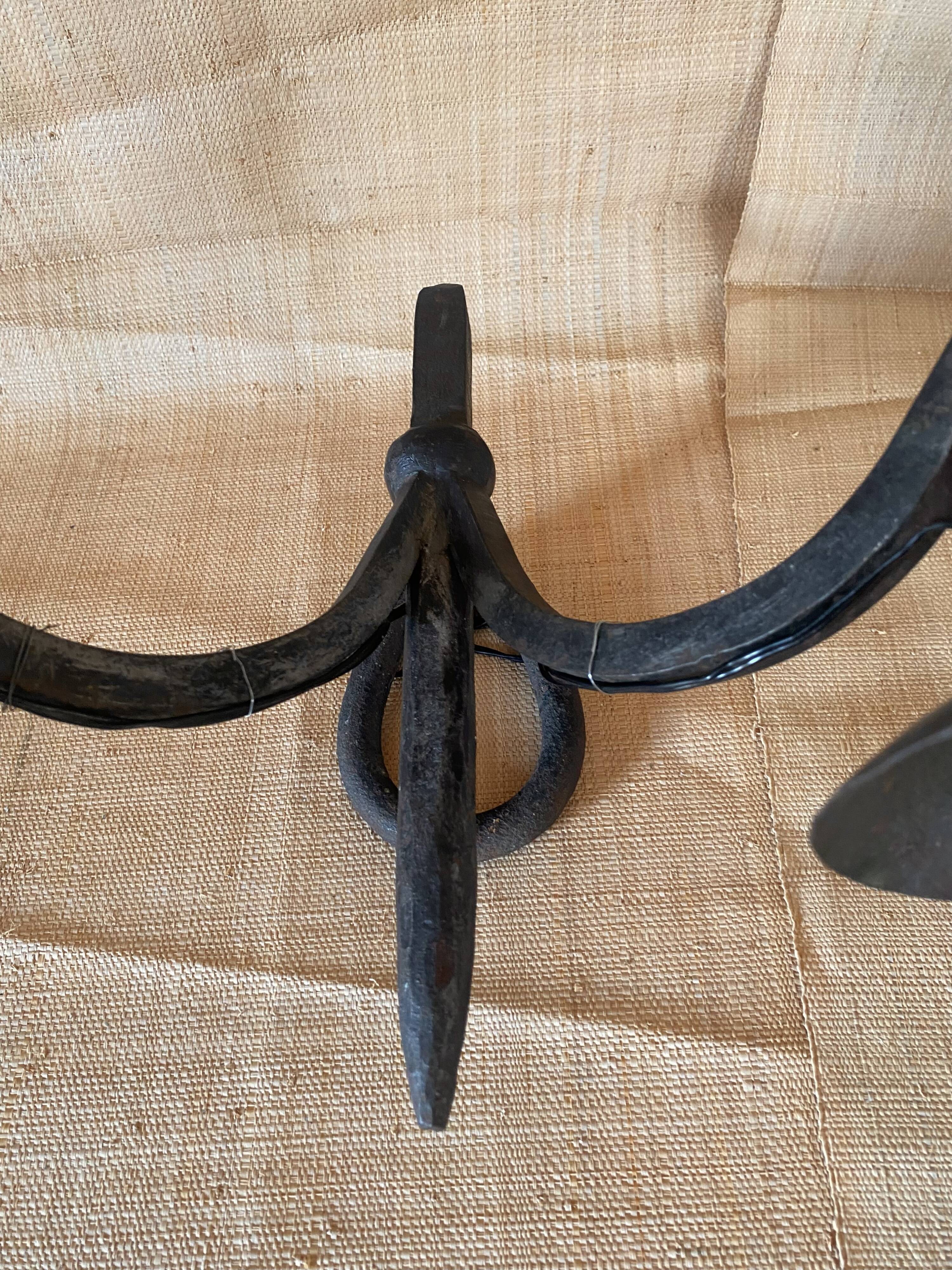 Wrought iron wall lights.