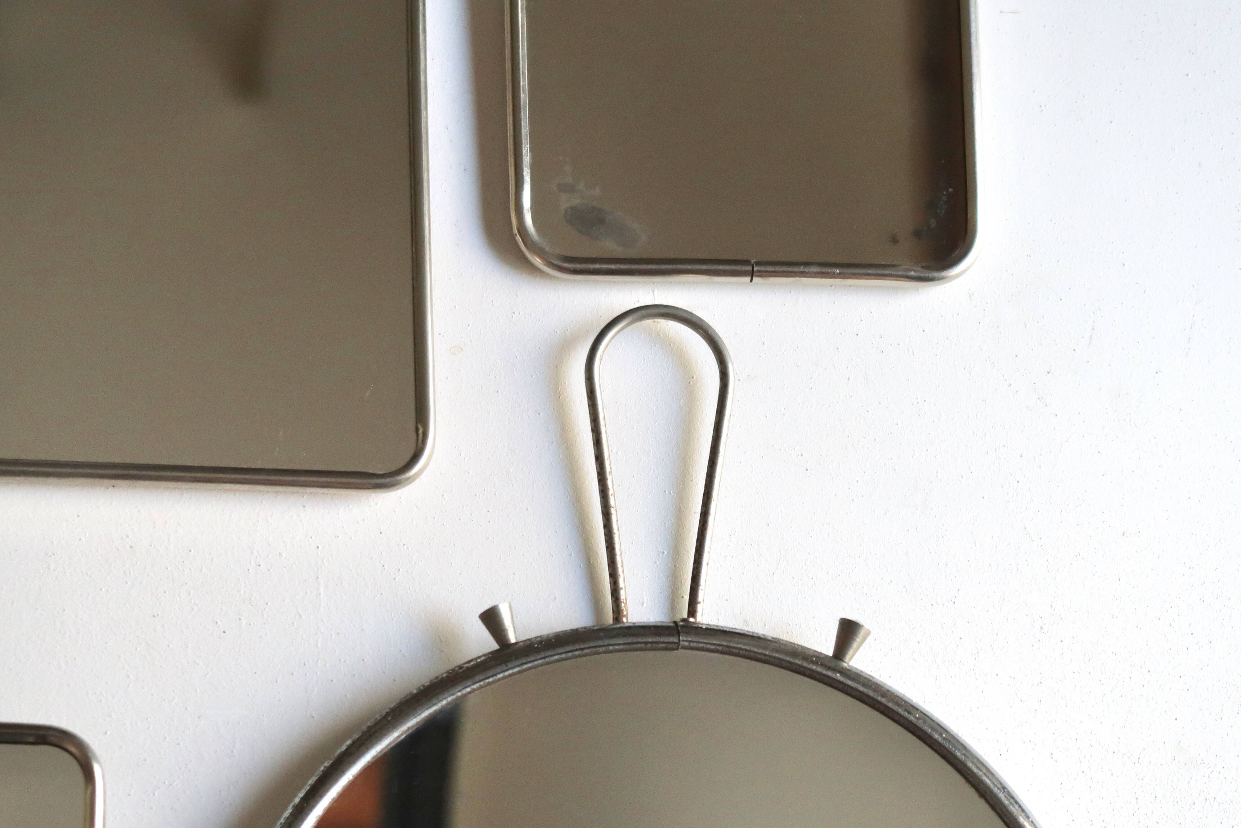 Set of four rectangular and round barber mirrors, 1950s.