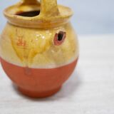 Old gargoulette pot in glazed terracotta