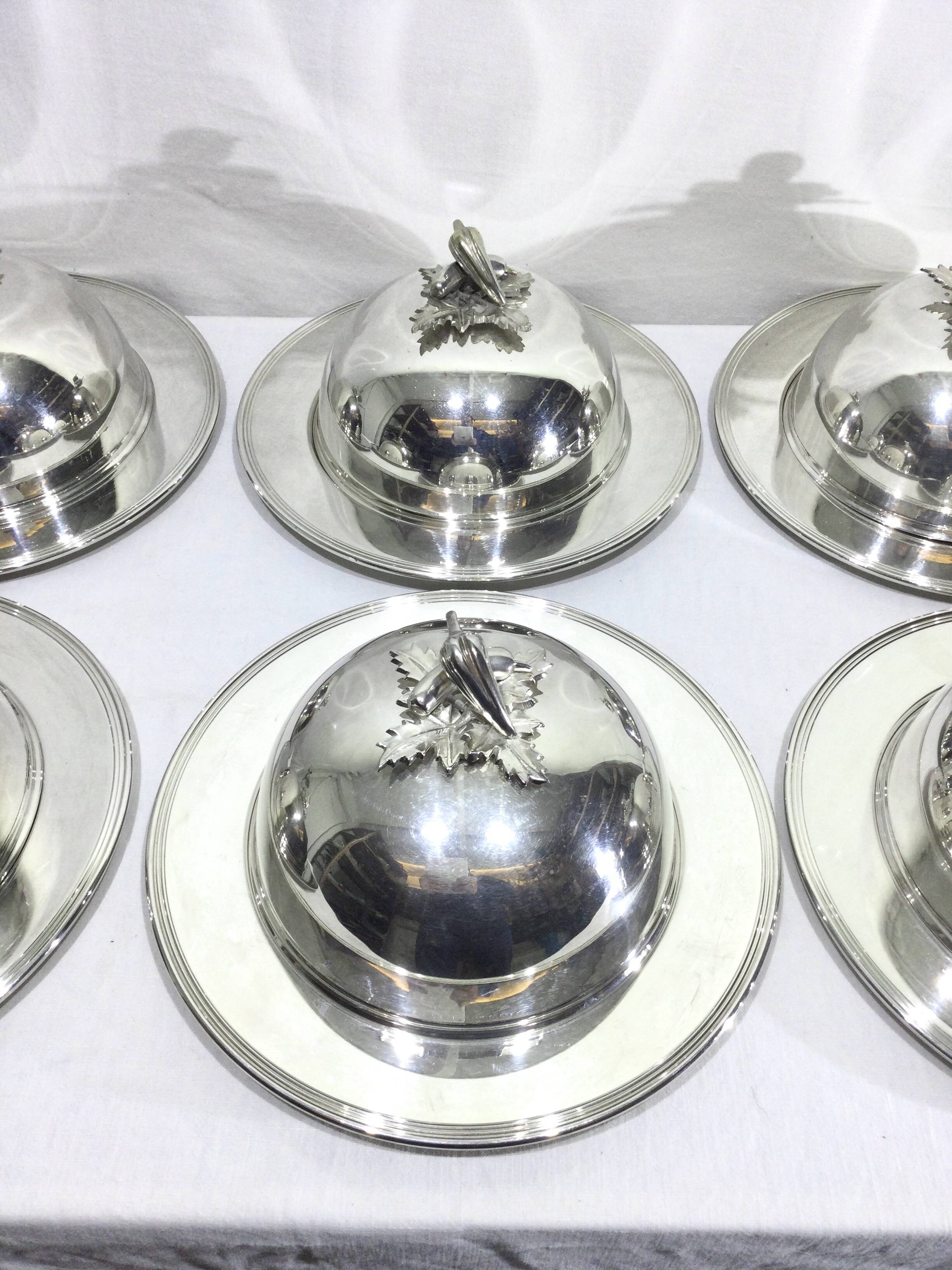 Set of silver-plated serving dishes and bells