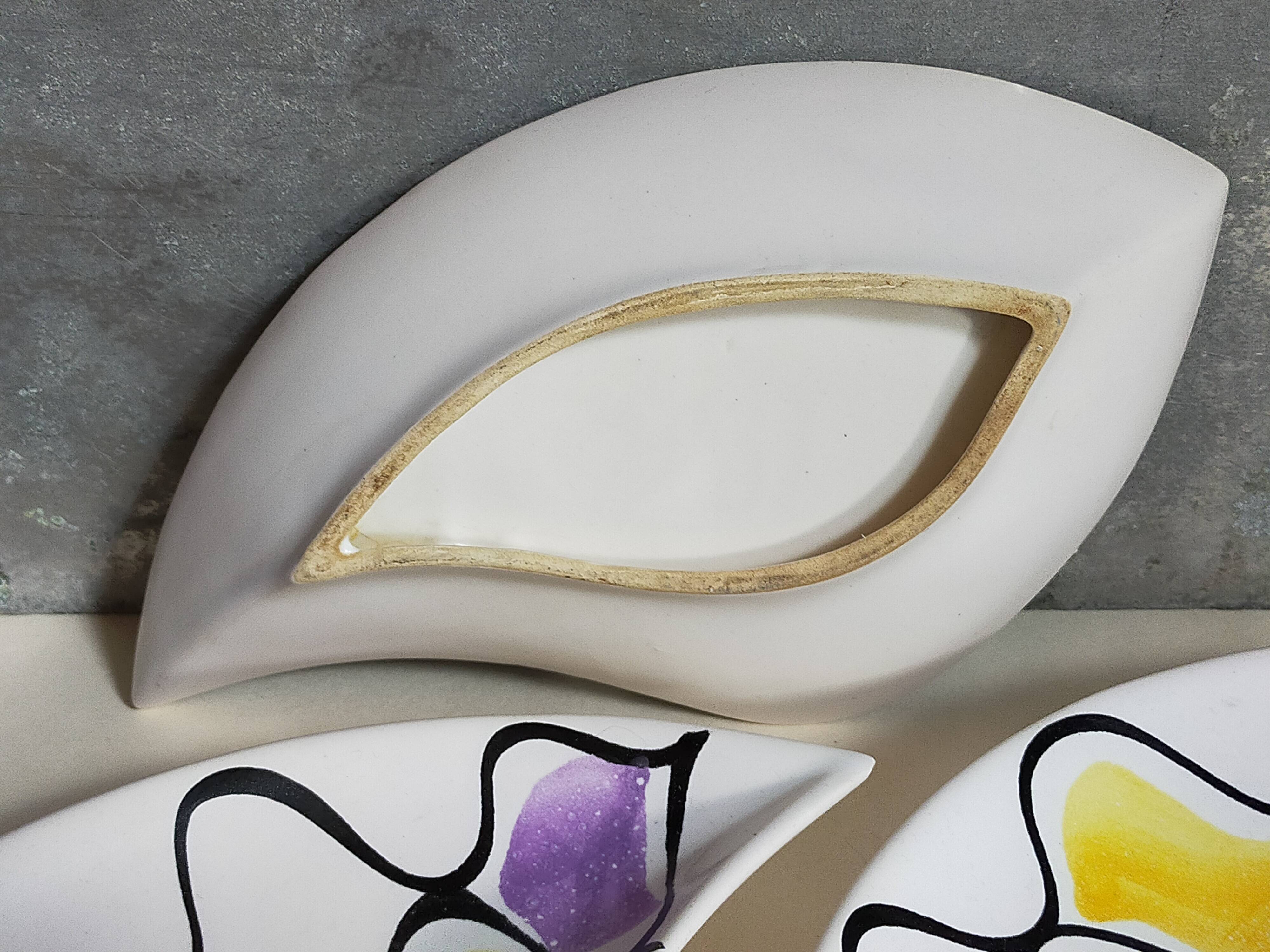 Three vintage free-form ceramic ravine dishes from the 1950s