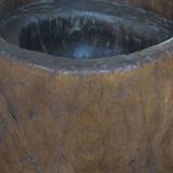 Antique hand carved mortar coffee table with circular glass top