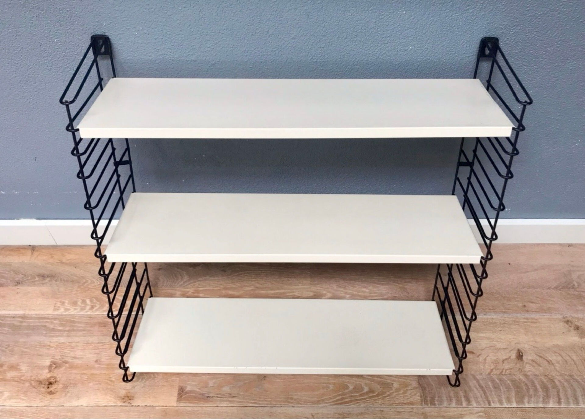TOMADO — Modular wall shelf, design from 1958