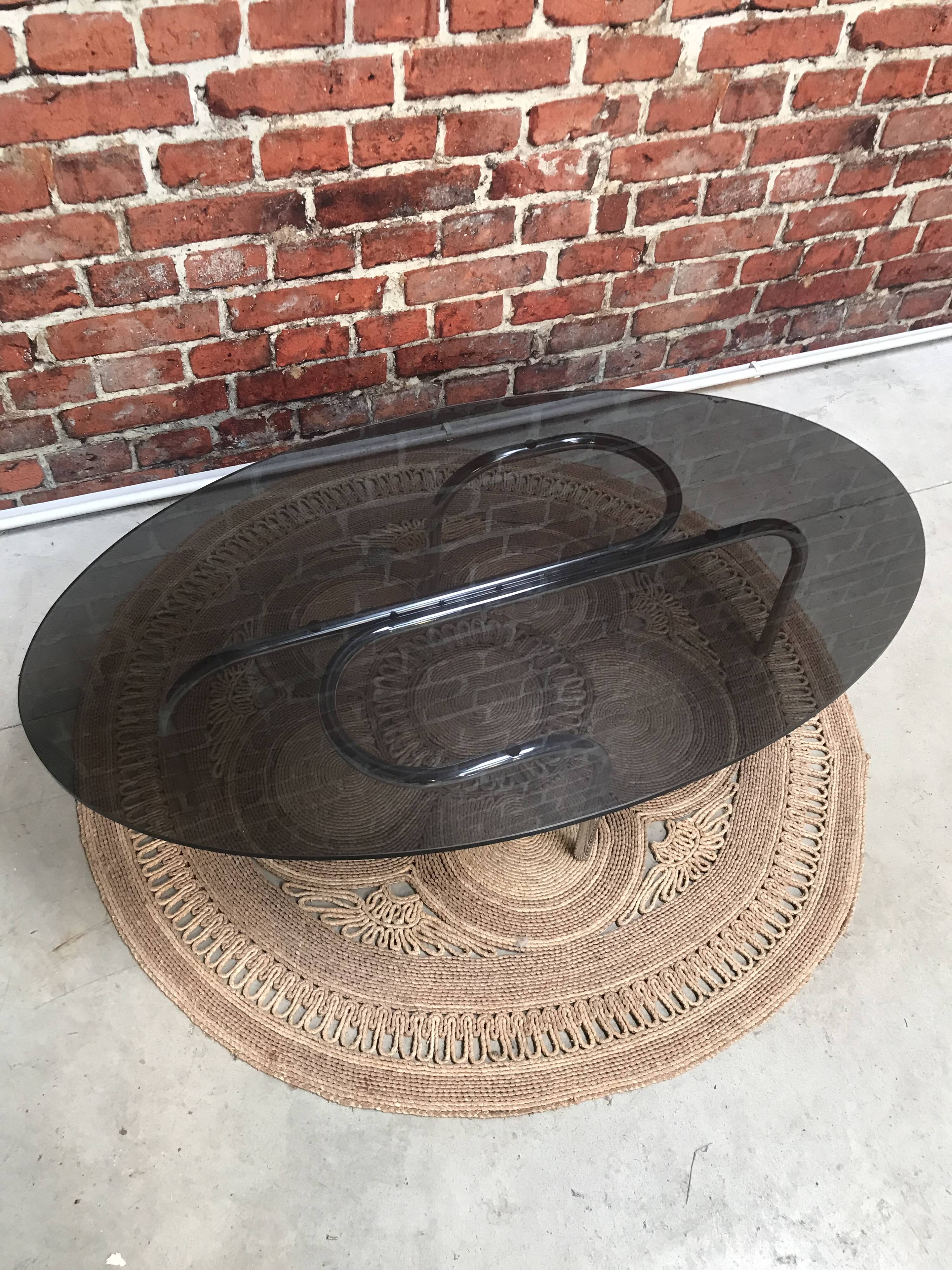 Vintage 70's oval coffee table in glass and chrome