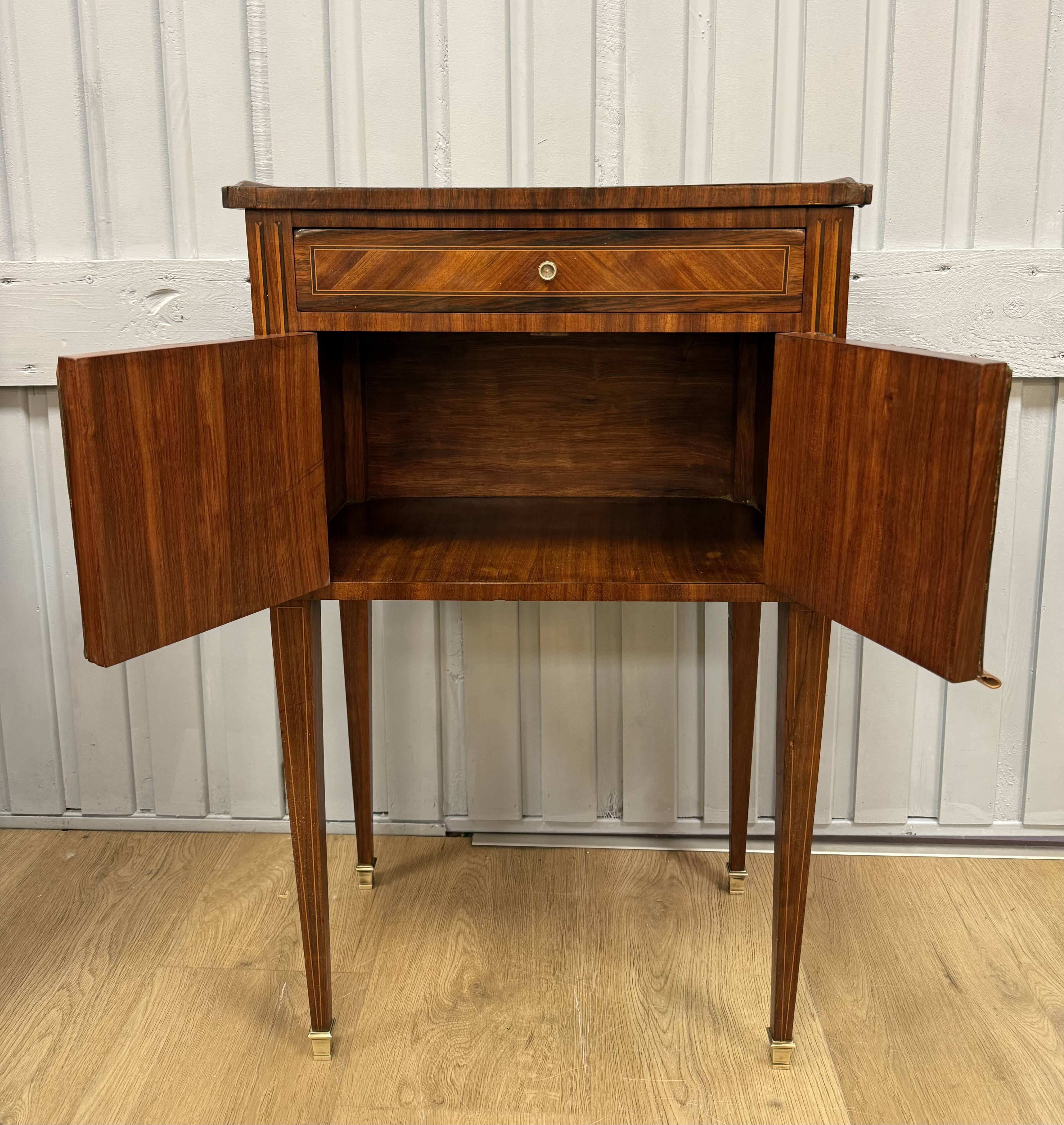 Side table with a faux book front.