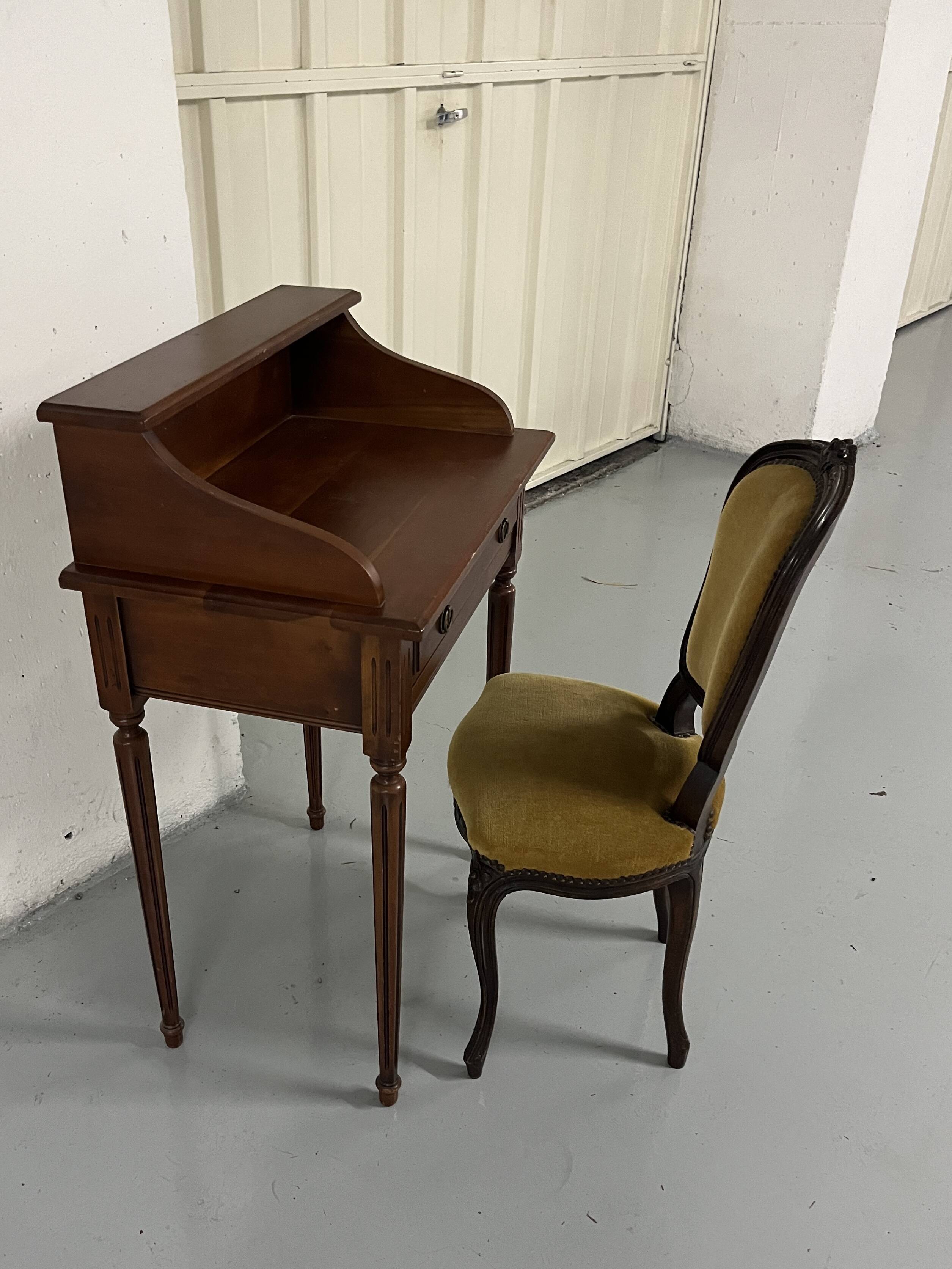 Old-fashioned secretary desk and chair set.
