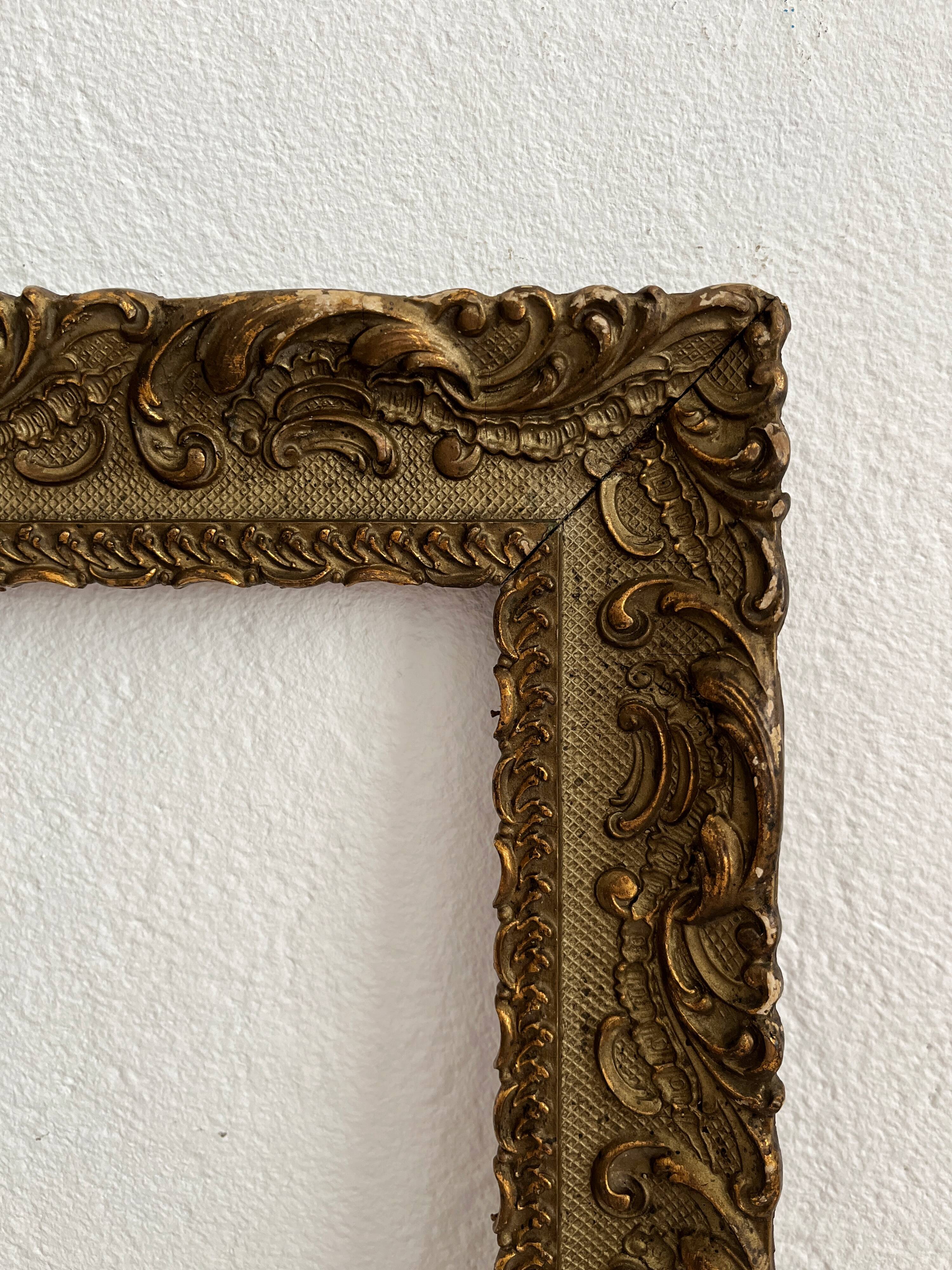 Old frame in gilded wood with stucco decoration circa 1900