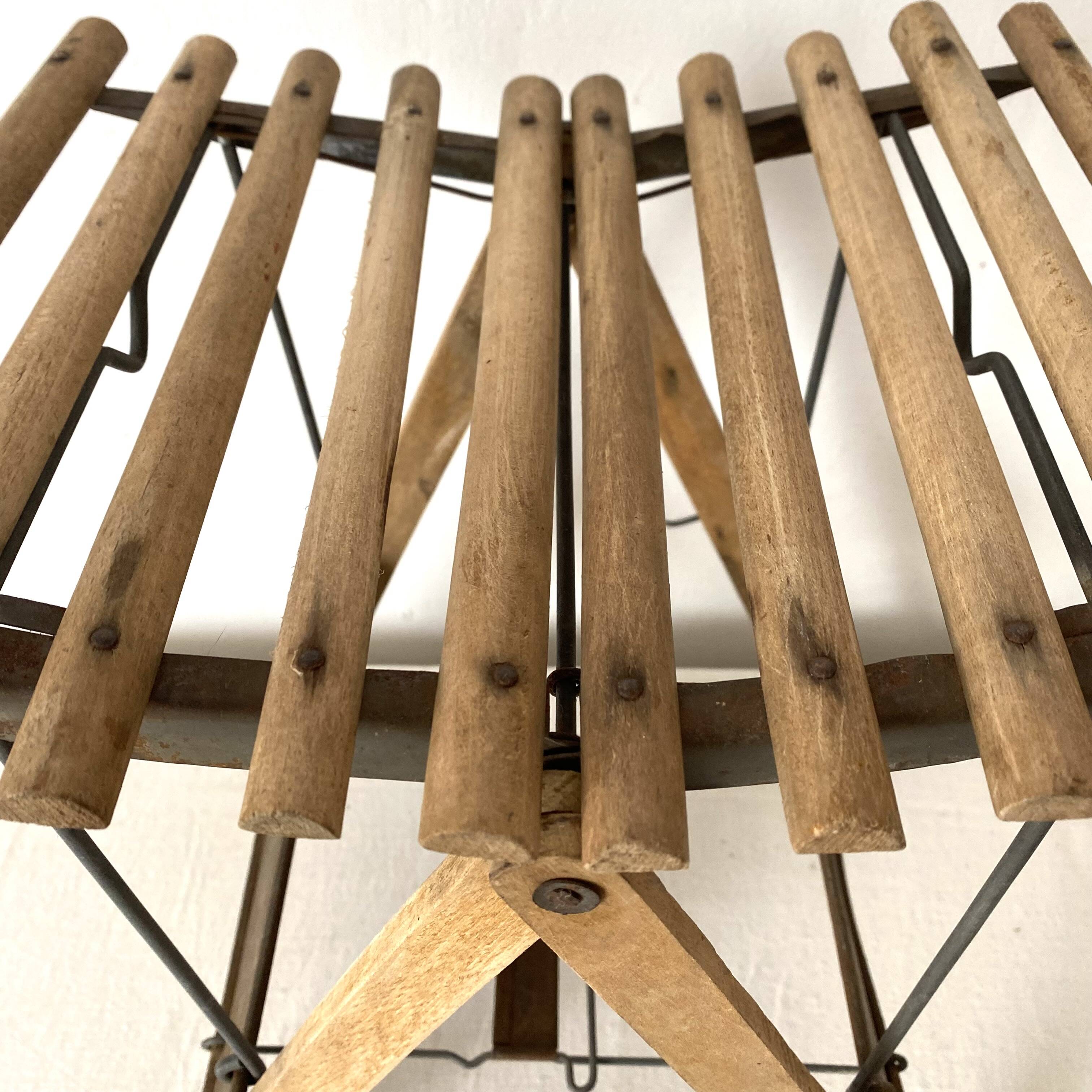 Antique folding stool with slats, plant holder