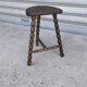 Turned wooden tripod stool