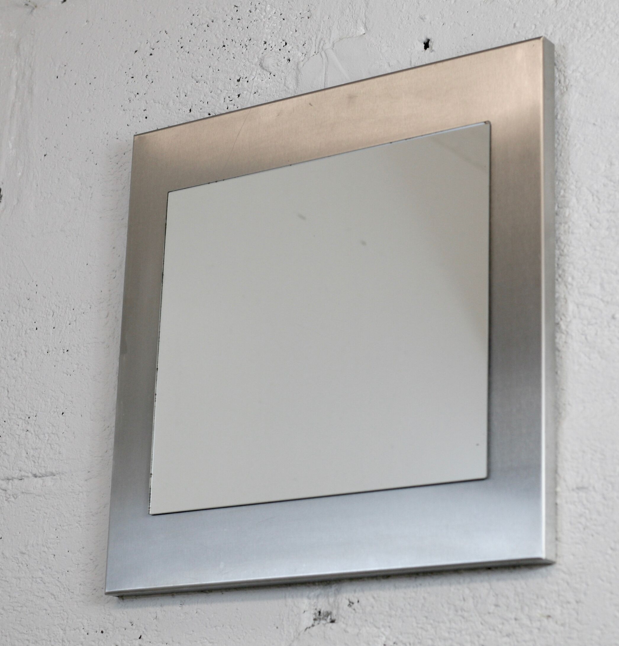 Mirror "space age". Stainless steel. France, circa 1970