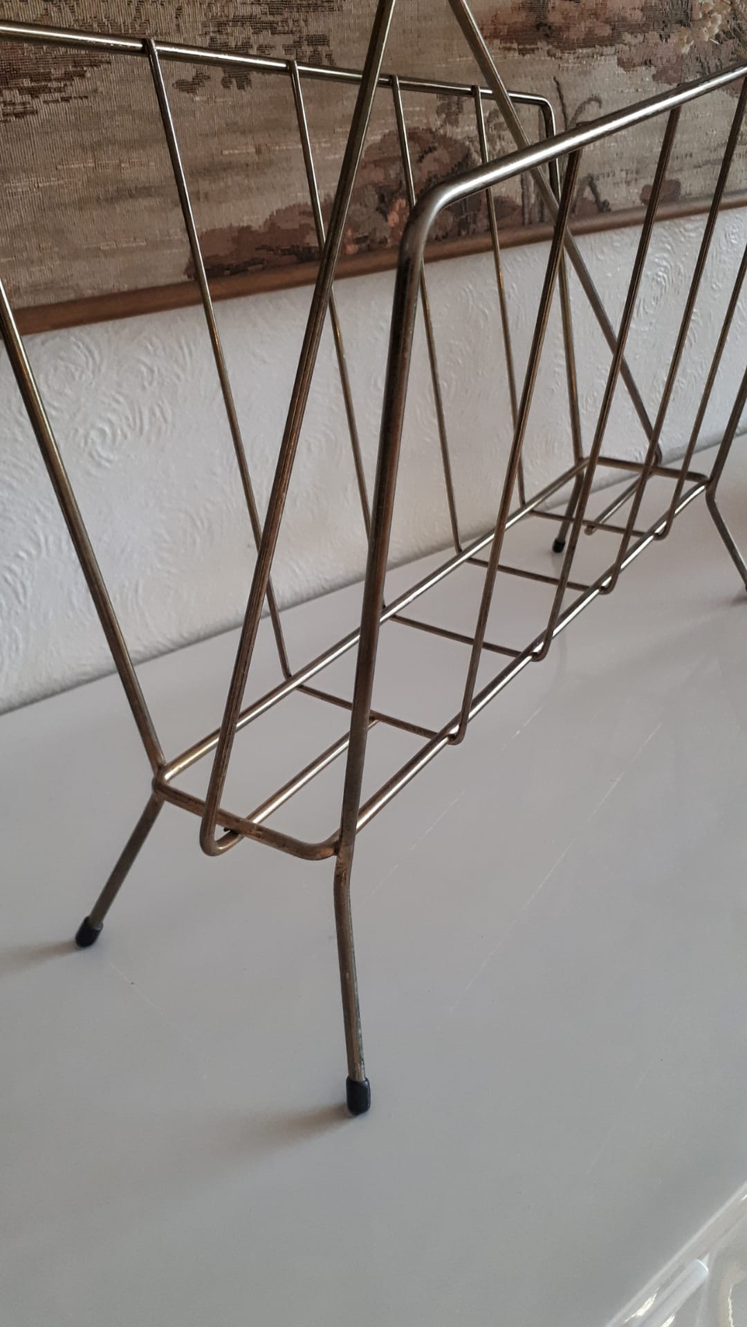 Gold metal newspaper holder