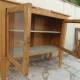 Art Deco sideboard in raw wood with a wax finish, closed by 2 glass doors.