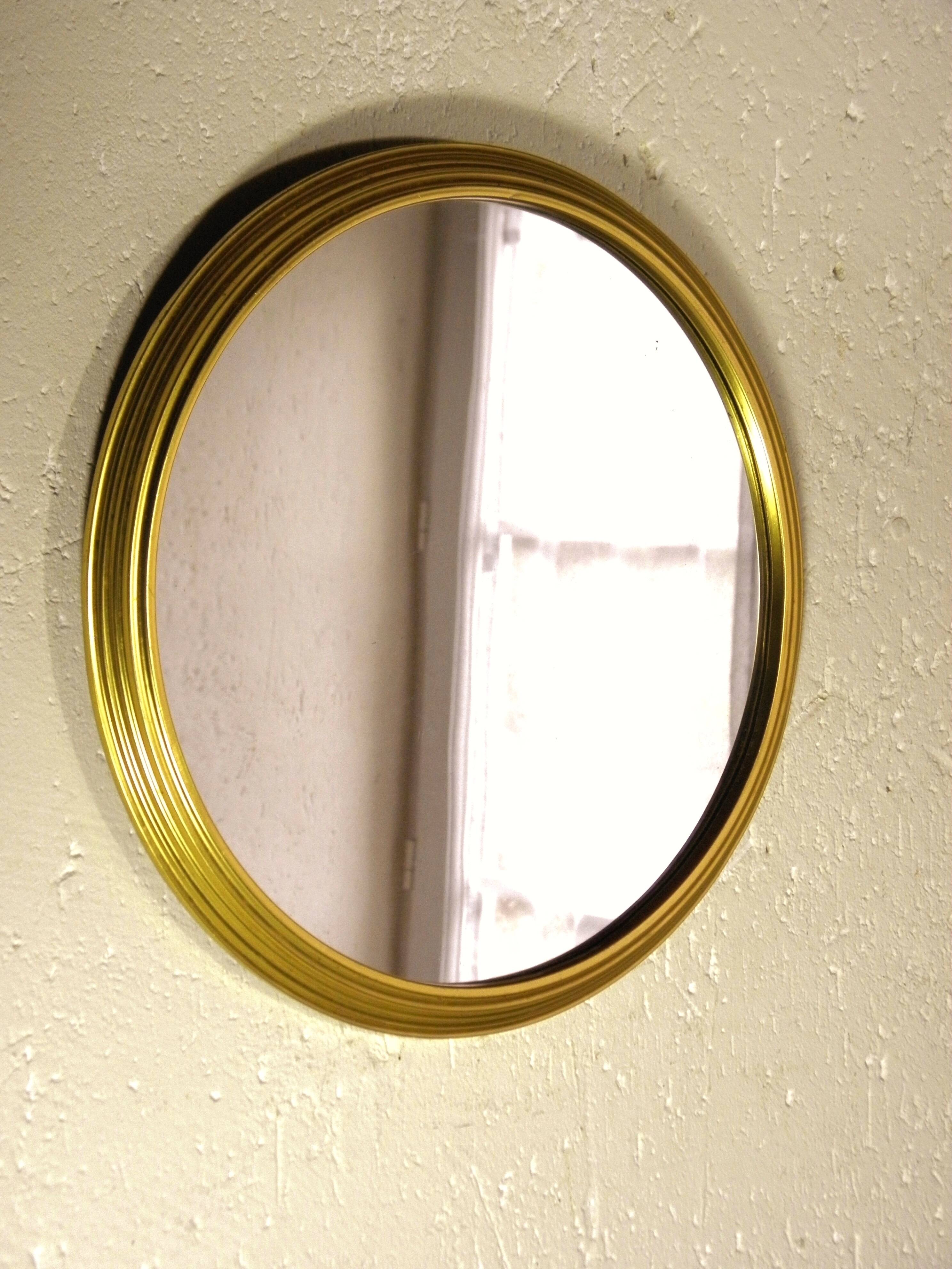 Round mirror with gold frame 31 cm