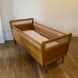Wooden and wicker baby bed