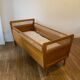 Wooden and wicker baby bed