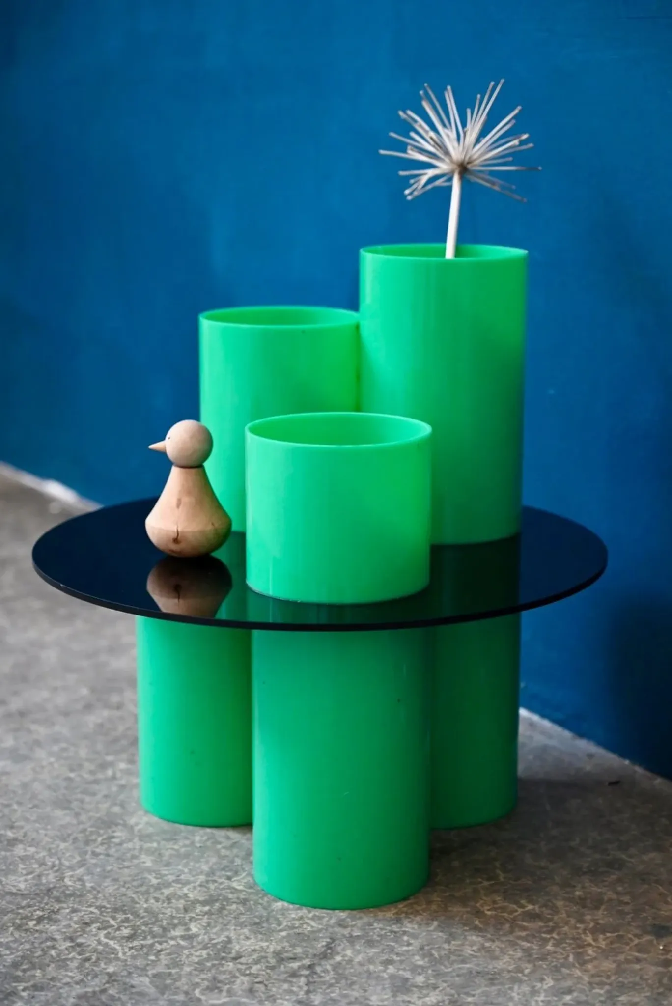 Green plexiglass coffee table in Memphis design style from the 1980s.