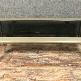 Design coffee table in gilded metal and tinted glass