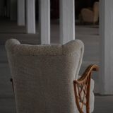 Pair of modern Swedish lounge chairs, shearling sheepskin and elm, 1940s.
