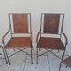 3 chairs and 2 armchairs in wrought iron and caned rattan, 1950s.