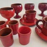 Red enamelled terracotta: cups, saucers, glasses