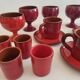 Red enamelled terracotta: cups, saucers, glasses