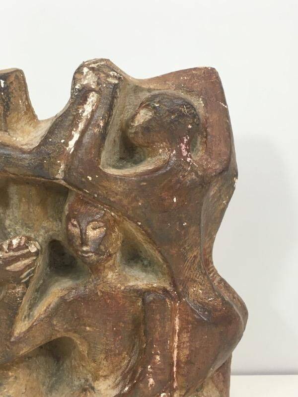 Plaster sculpture depicting a group of 3 figures