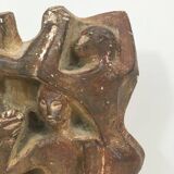 Plaster sculpture depicting a group of 3 figures